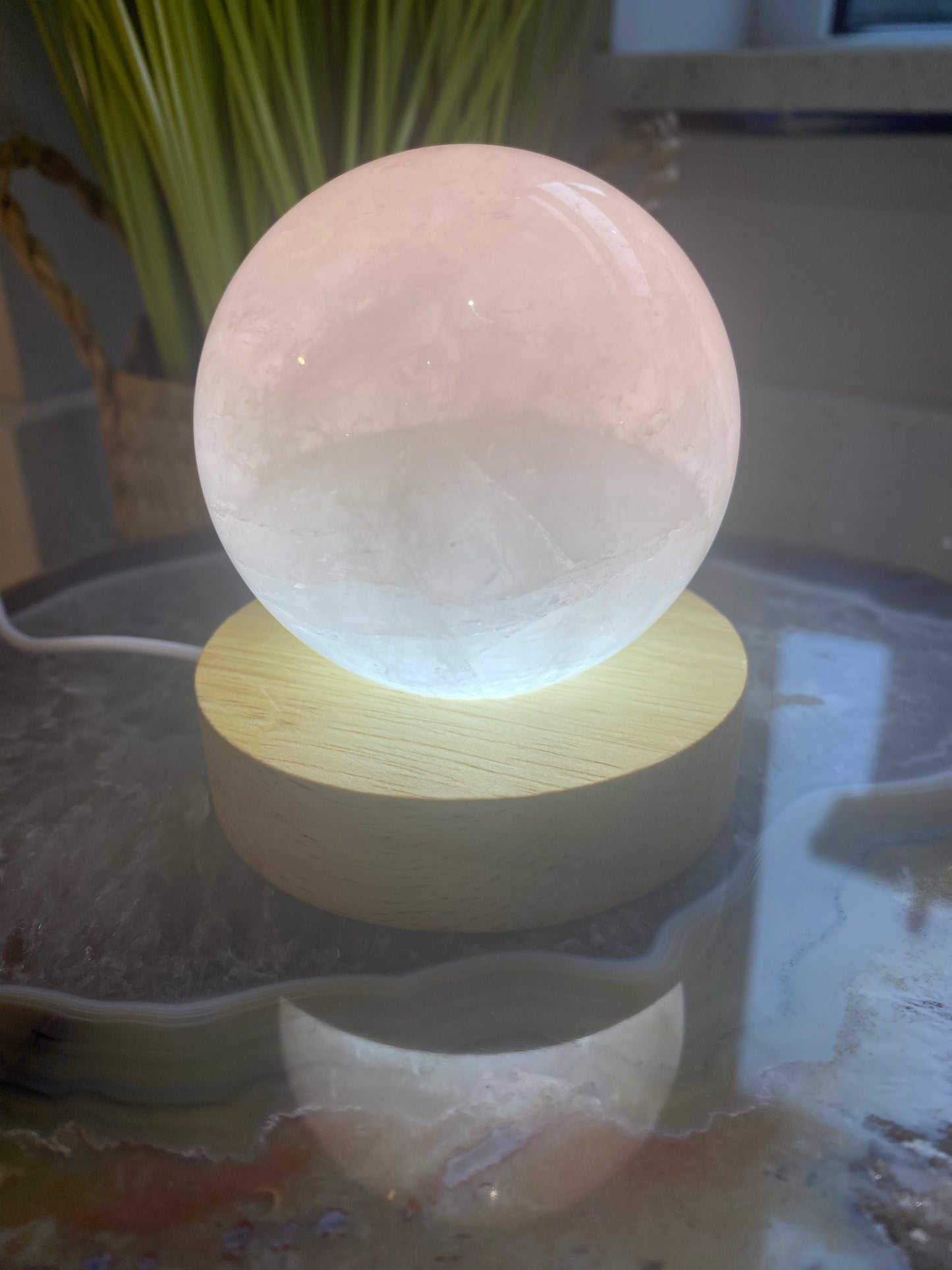 Rose quartz sphere on light up stand